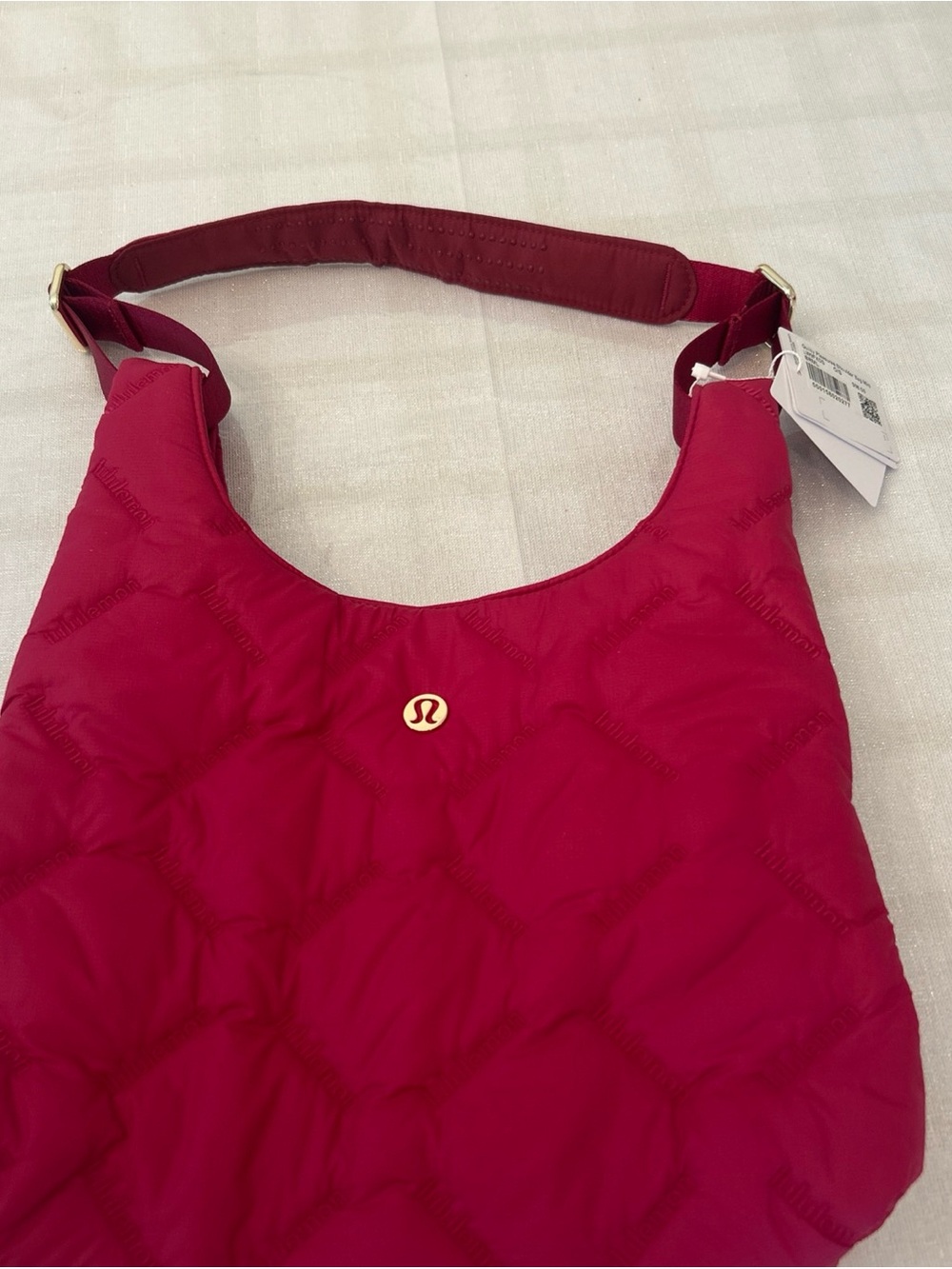 lululemon athletica Quilted Shoulder Bag in Berry Pink with Gold Logo